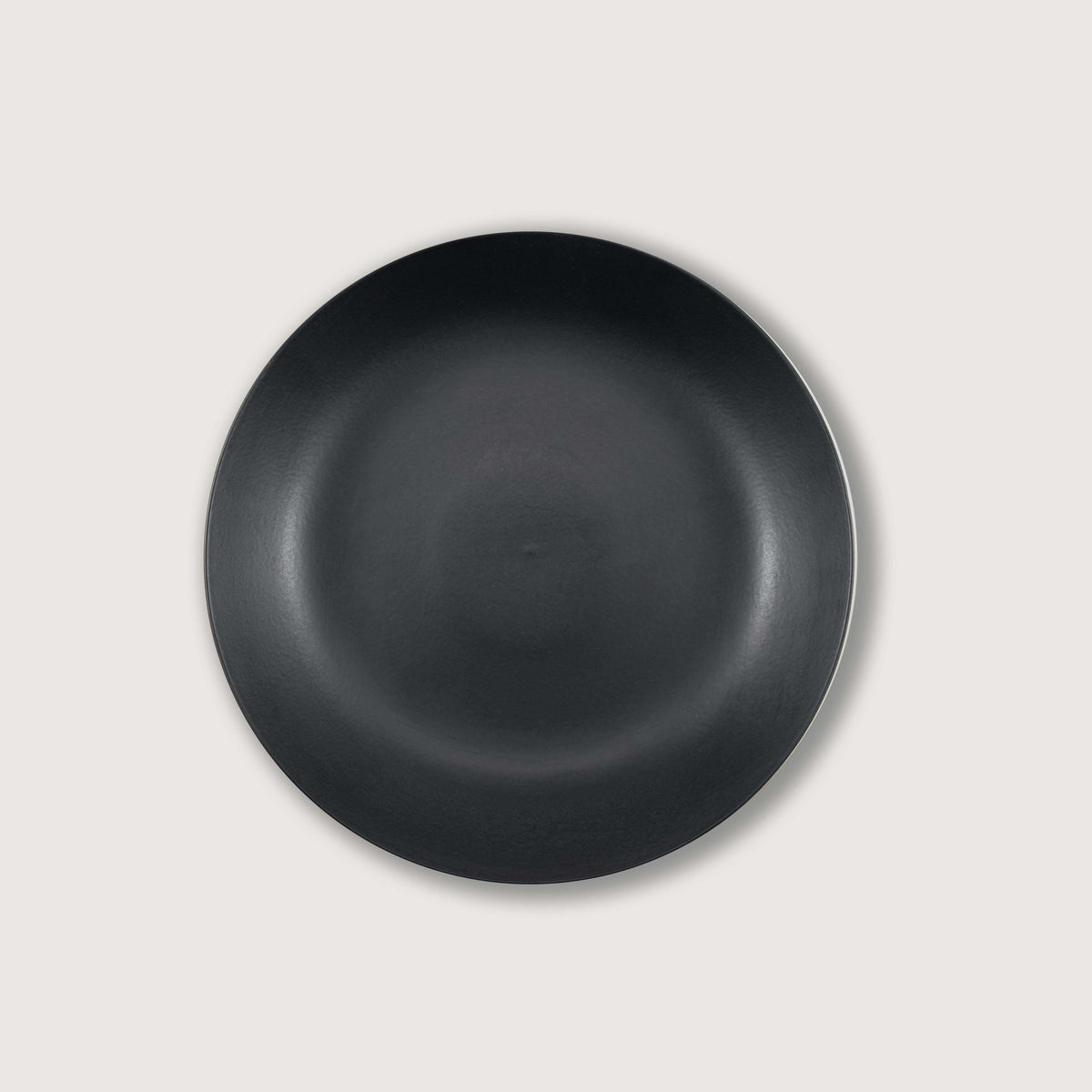 Matte Black Ceramic Footed Bowl, ideal for home decorations and fruit display, featuring a clean finish and hand-finished design.