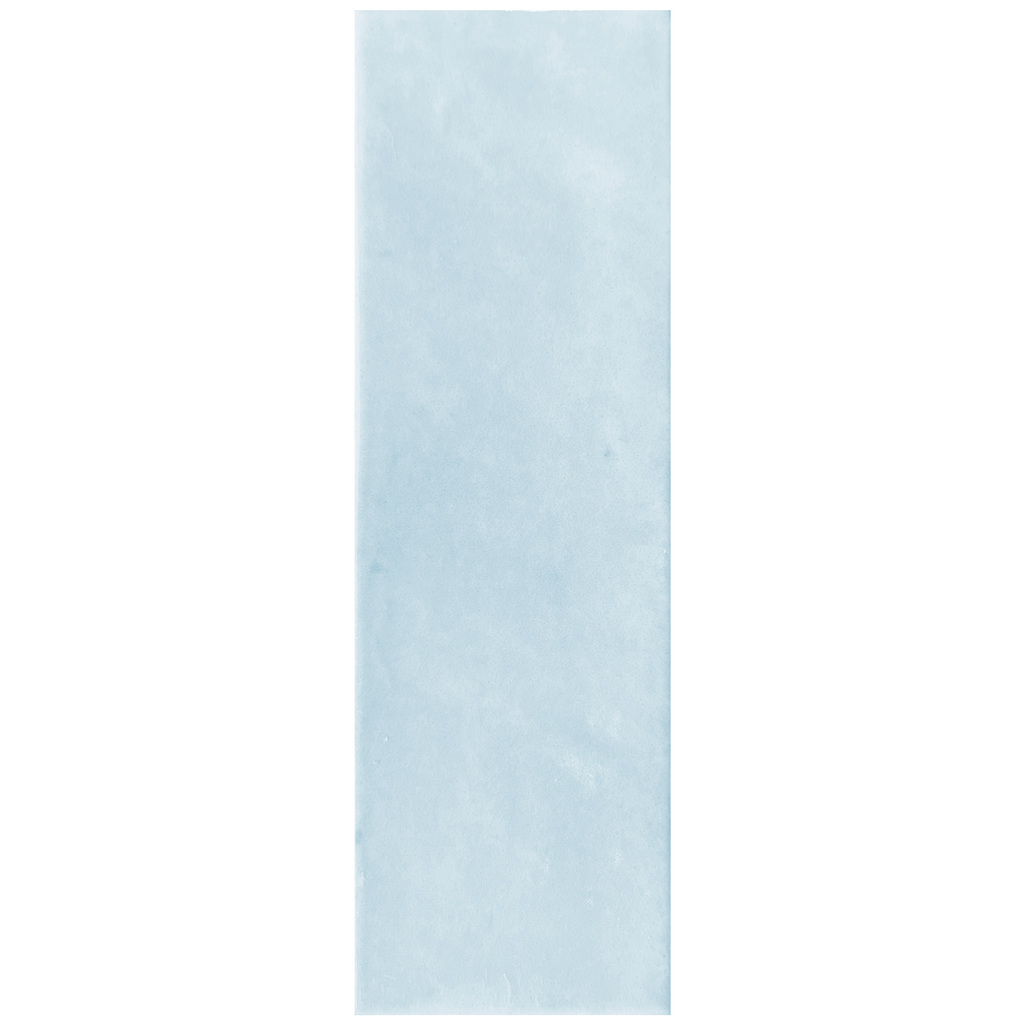 Candy 2x6" porcelain tile in a soft blue color, featuring a glossy, textured surface ideal for elegant spaces.
