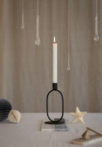 Eternal Oval Candle Holder with white candle, embodying harmony and balance in a minimalist design.
