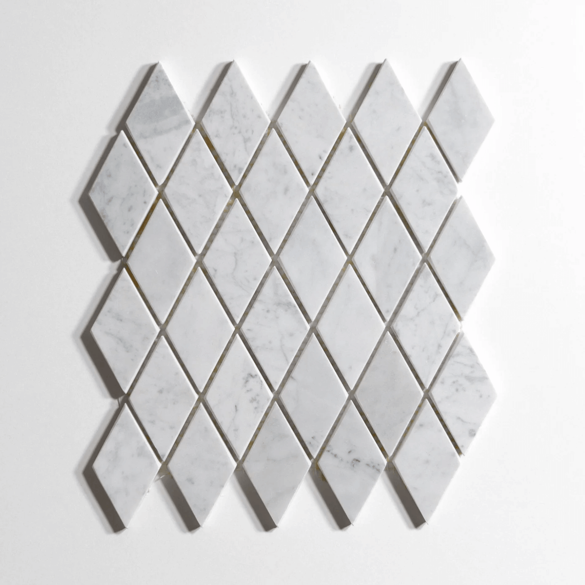 Venatino Carrara marble tile, harlequin mosaic pattern, white with soft gray veining