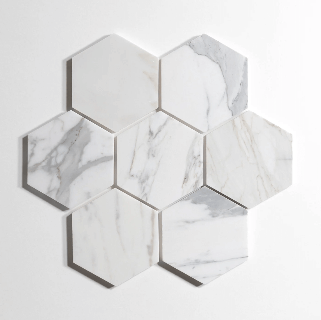 Calacatta marble tile, hexagon shape, white with dramatic gray veining, 5 inch
