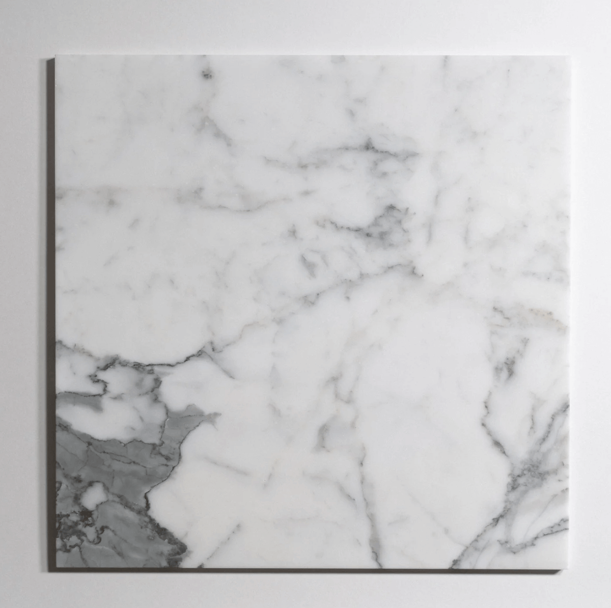 Calacatta marble tile, white with dramatic gray veining, 18x18 inch