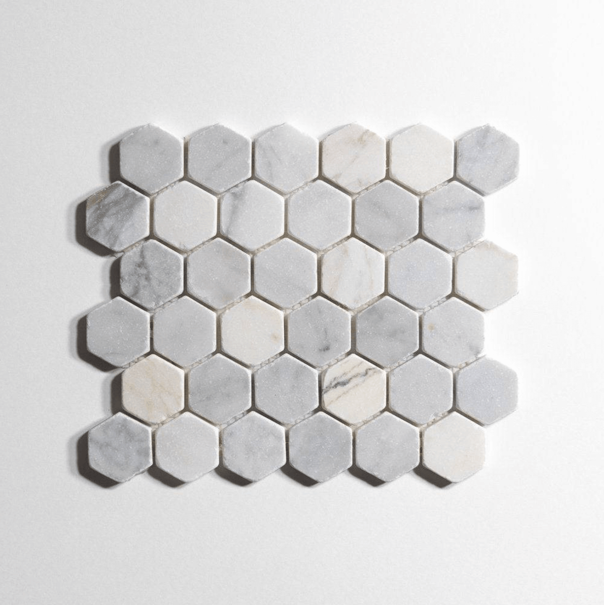 Antique Carrara marble tile, hexagon shape, soft white-gray