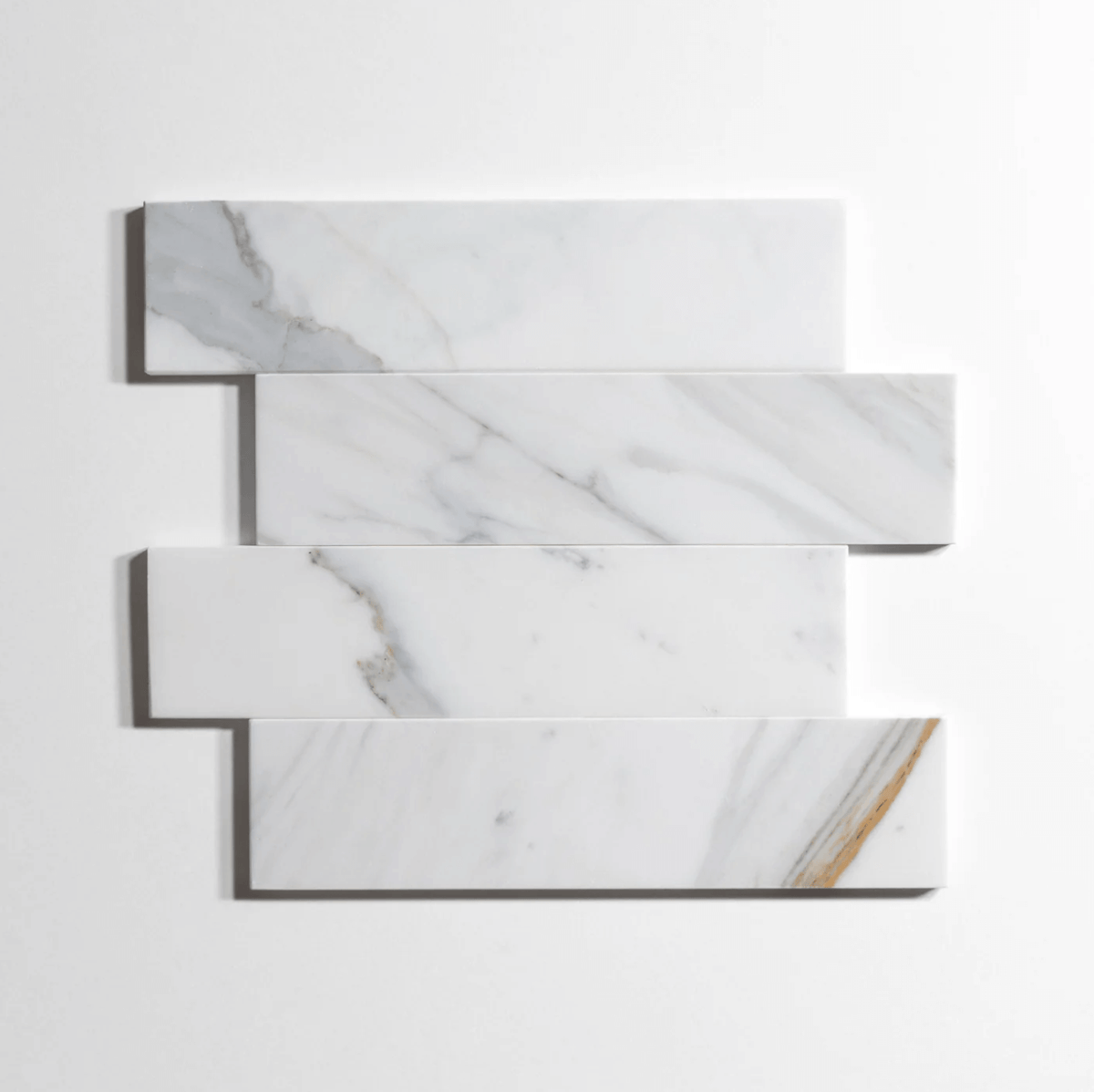 Calacatta marble tile, white with dramatic gray veining, 3x12 inch